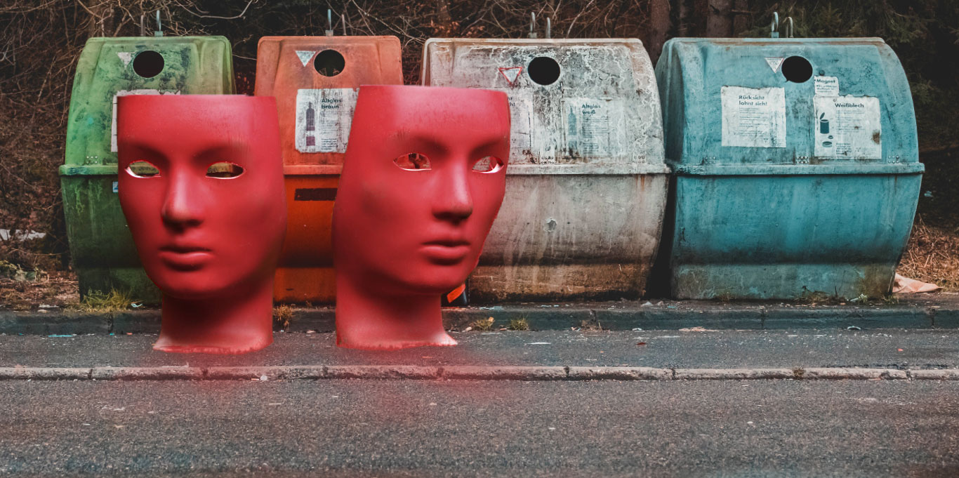 Garbage bins lined up on the footpath