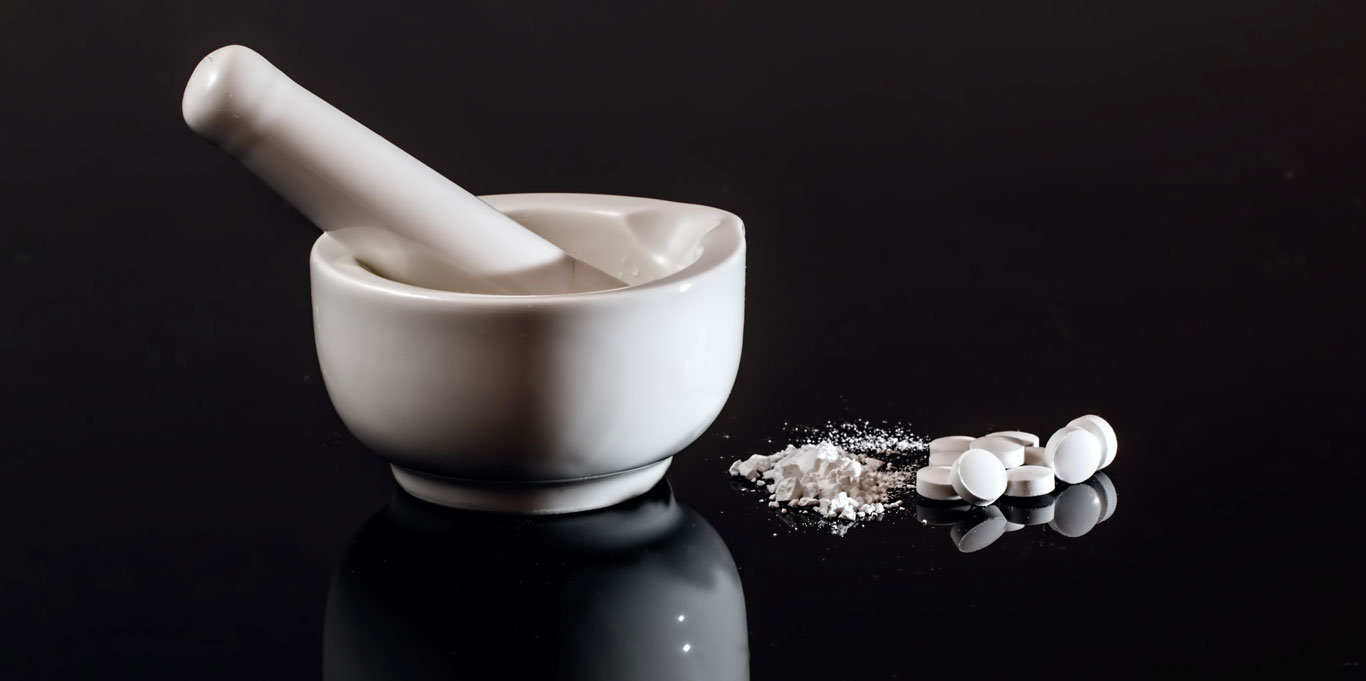 Mortar and pestle with crushed tablets