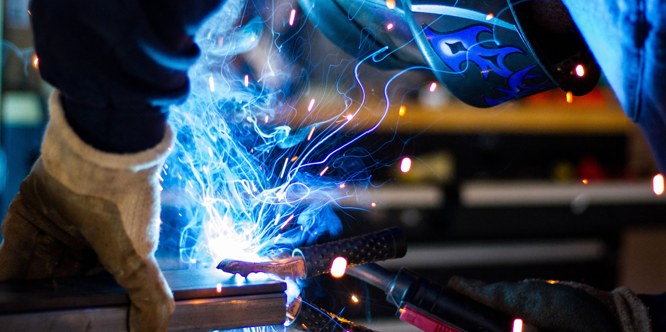 Person in protective mask welding