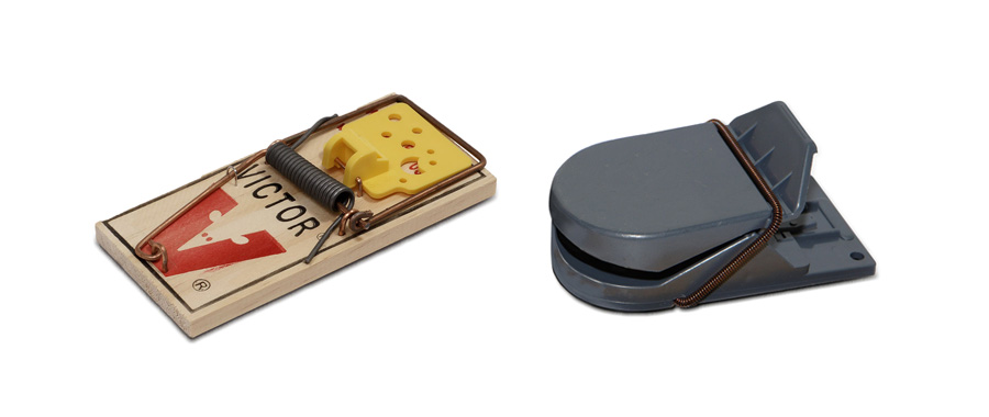 Two mouse traps: one made of wood and wire, the other constructed of moulded plastic. Both have springs.